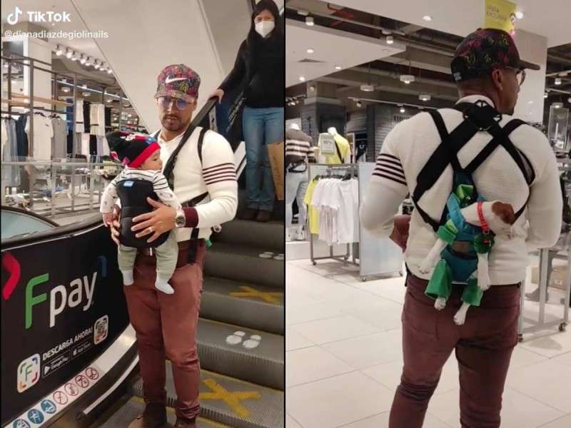 Carga a su hijo y a su perrito papá luchón con cangurera mientras esperan a mamá