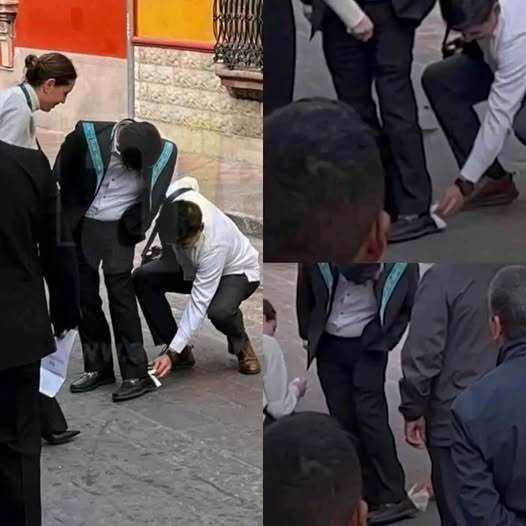A sus pies, señor: Limpian empleados zapatos a Hugo Aguilar